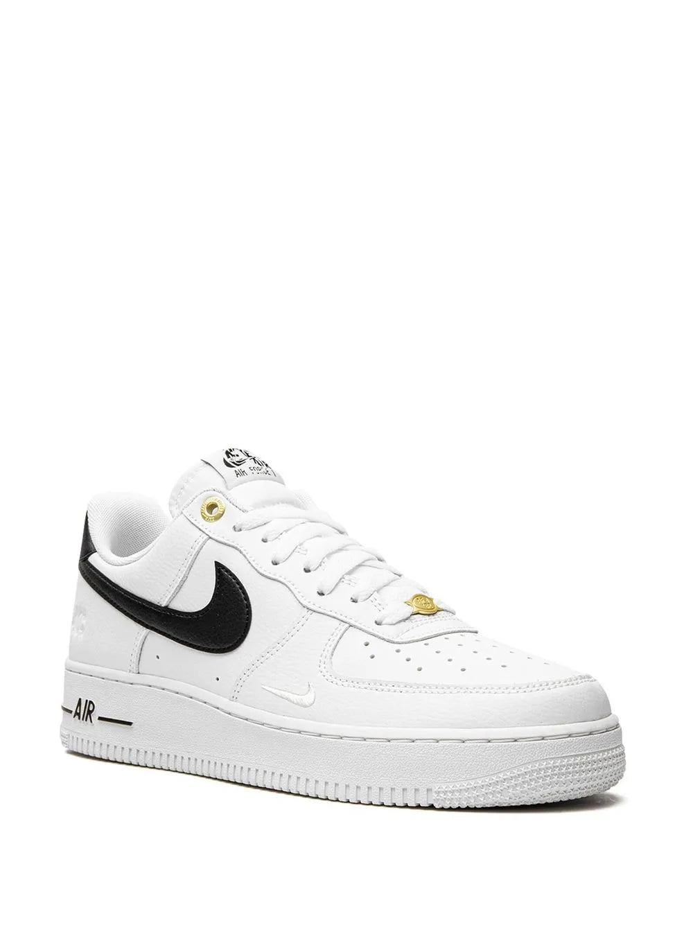 Nike Air Force 1 low-top sneakers, white upper with black swoosh and lace-up front
