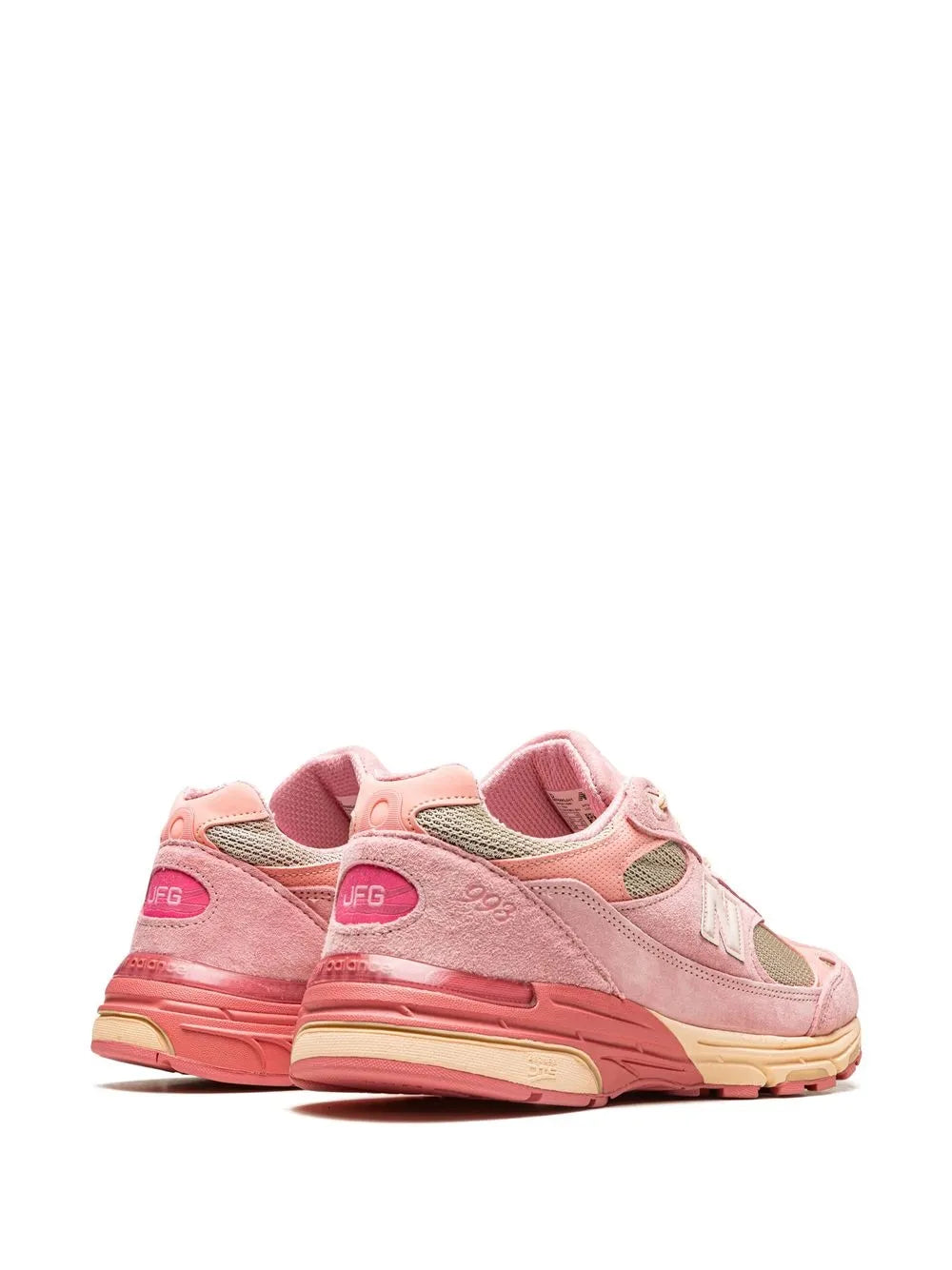 Light pink New Balance 993 sneakers, rear/side view with JFG heel tag