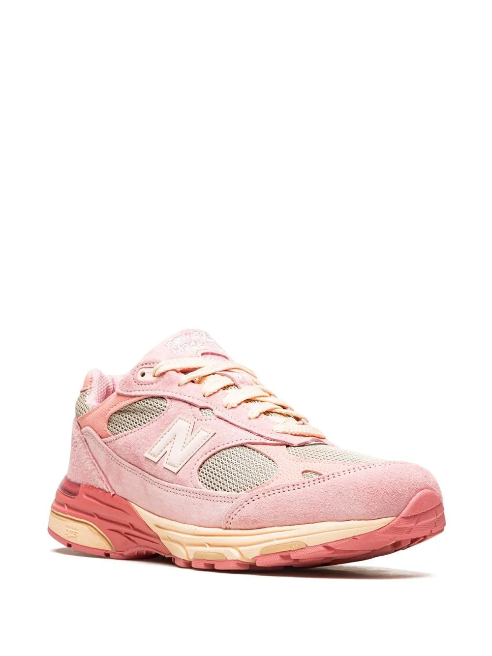 Light pink lace-up New Balance 993 sneakers, side view with mesh panels