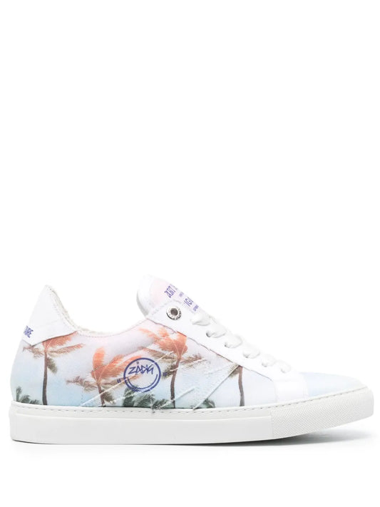 White low-top lace-up sneakers with palm tree print and rubber cupsole