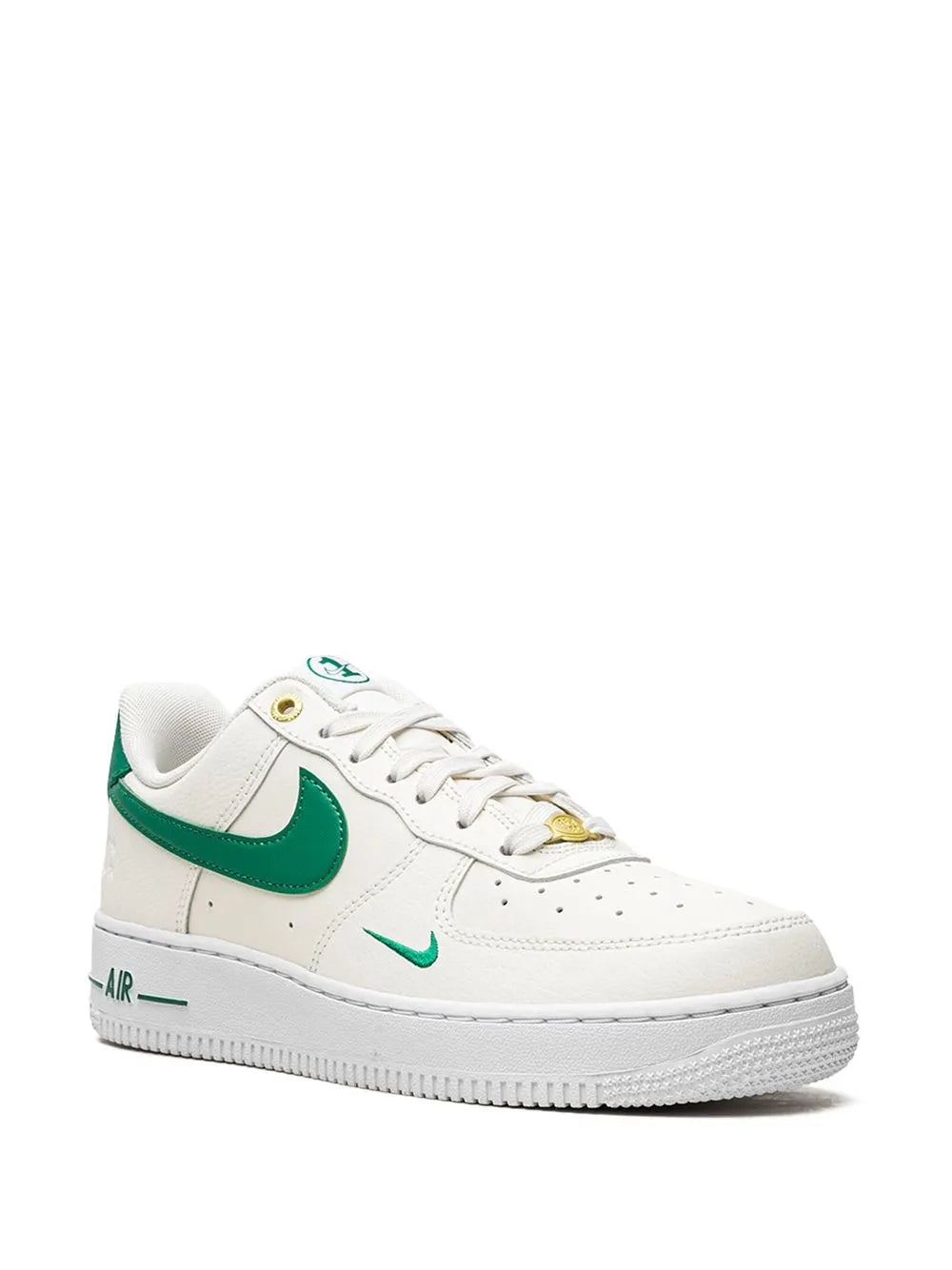 Nike low-top sneakers in white with green swoosh, lace eyelets, and 'AIR' detail