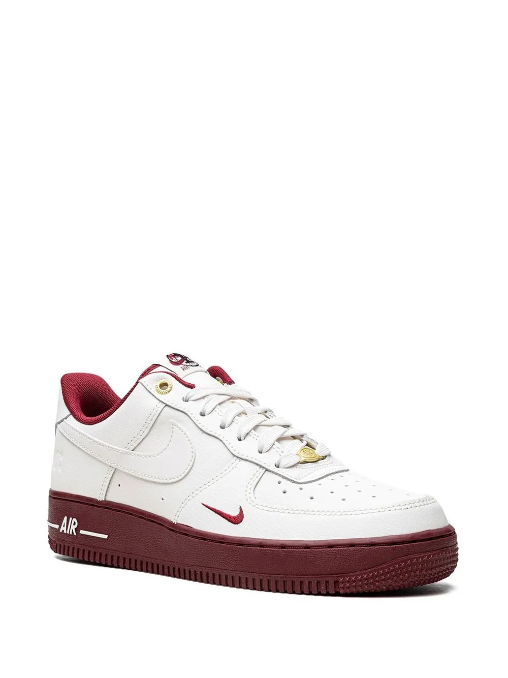 White Nike low-top sneaker with burgundy collar, swoosh, and Air lettering