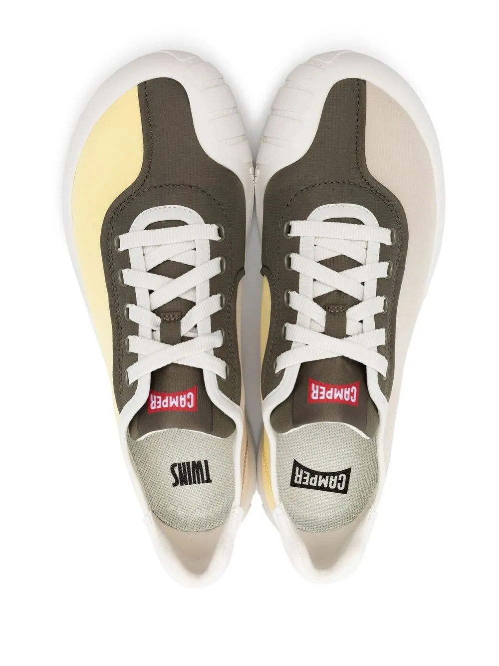 Pair of low-top sneakers: dark gray uppers, white laces, red logo labels, white rubber soles.