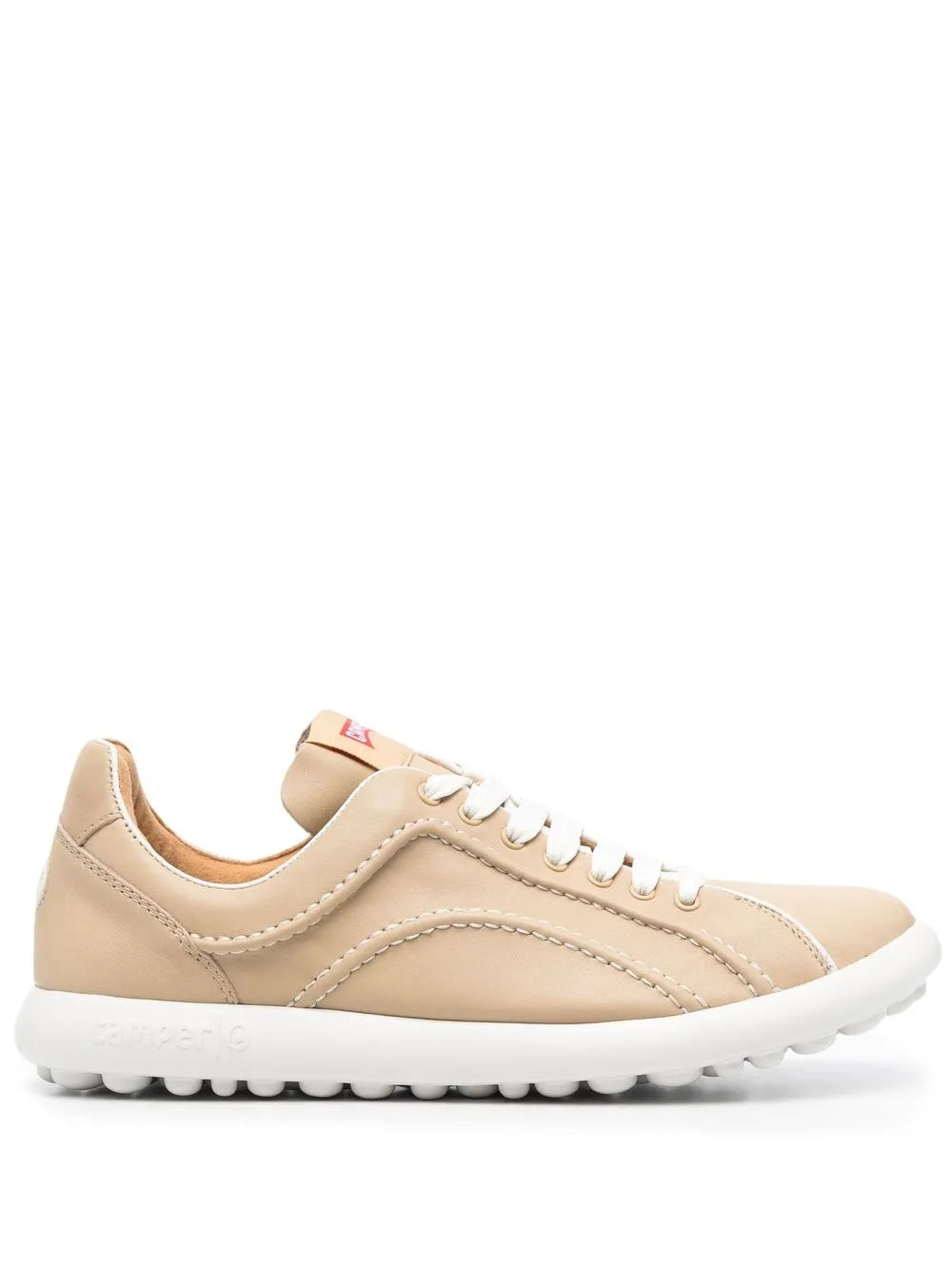 Beige low-top lace-up sneaker with cushioned sole and side stitching