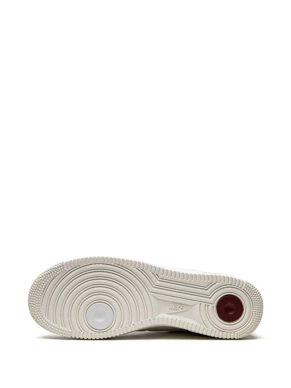 Nike Air Force 1 low-top shoe outsole, white tread with burgundy circular detail