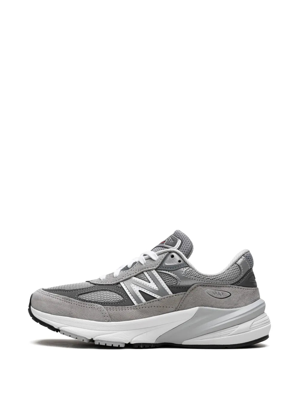 Grey New Balance sneakers, front/side view, white laces and streamlined uppers