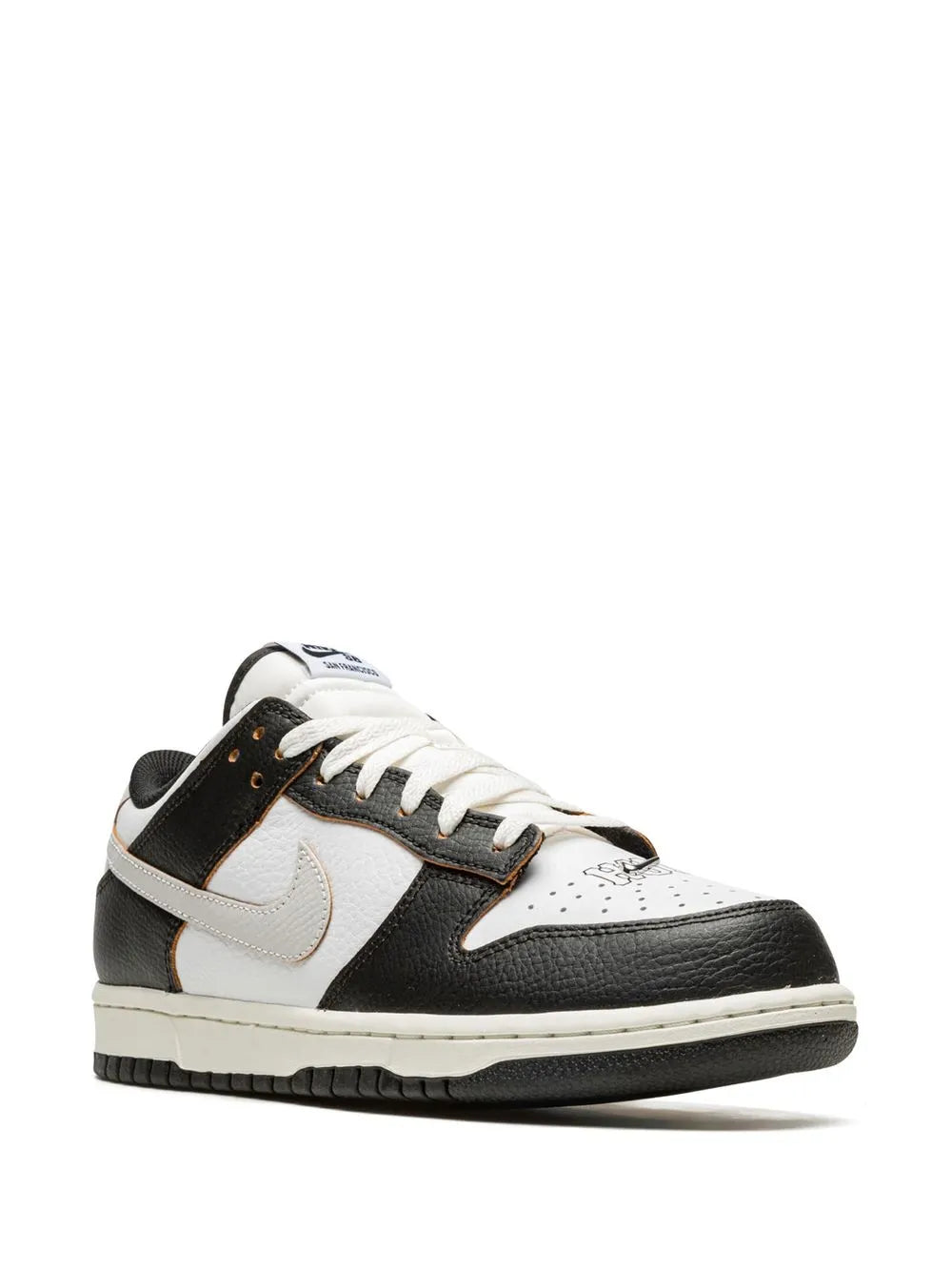Black and white Nike low-top sneakers, front quarter view with white Swoosh