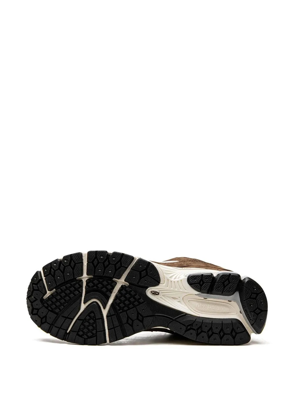 Running sneaker outsole with black tread and beige midsole