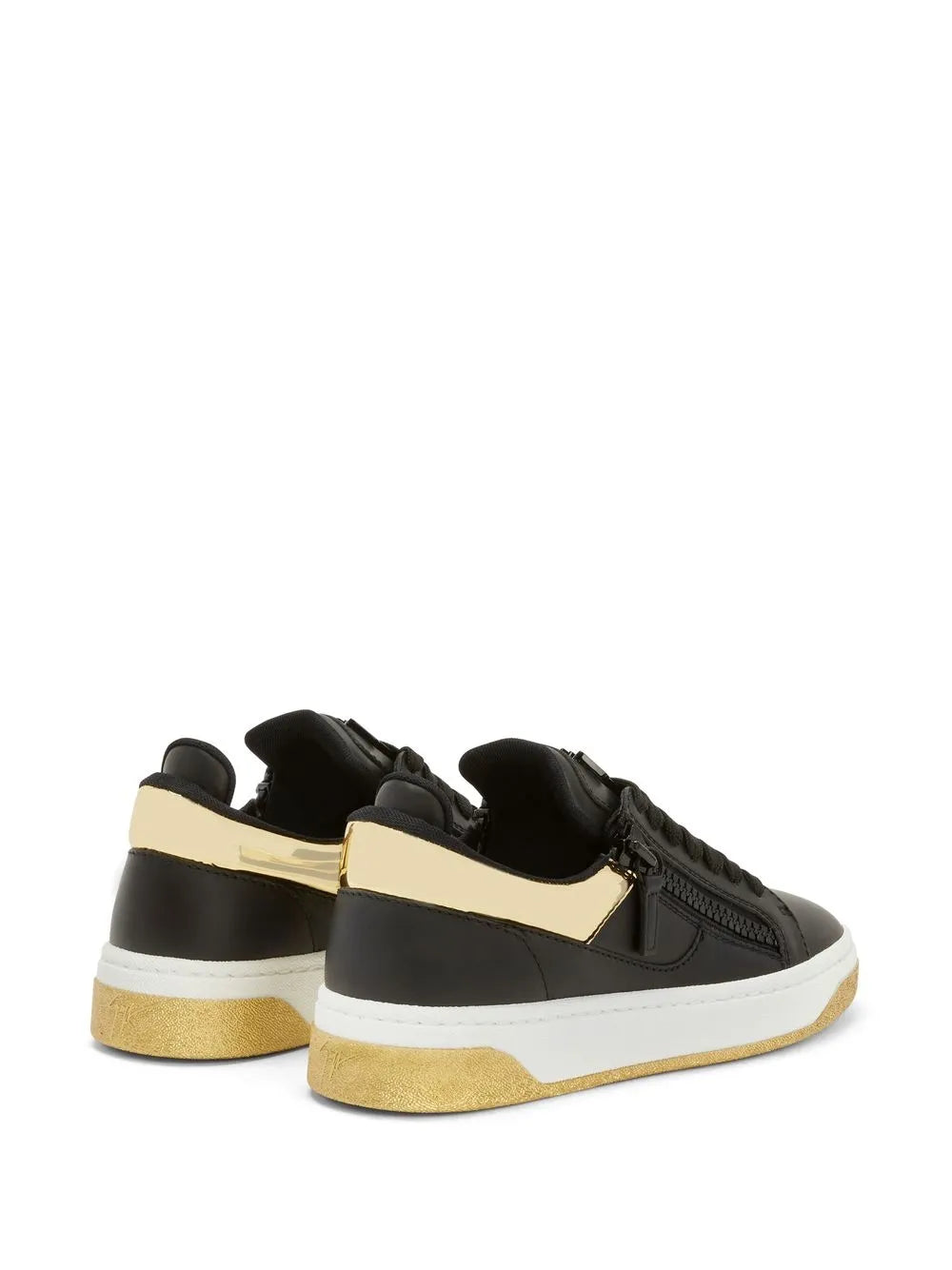 Black low-top sneakers with double zipper, white sole, and beige heel panel