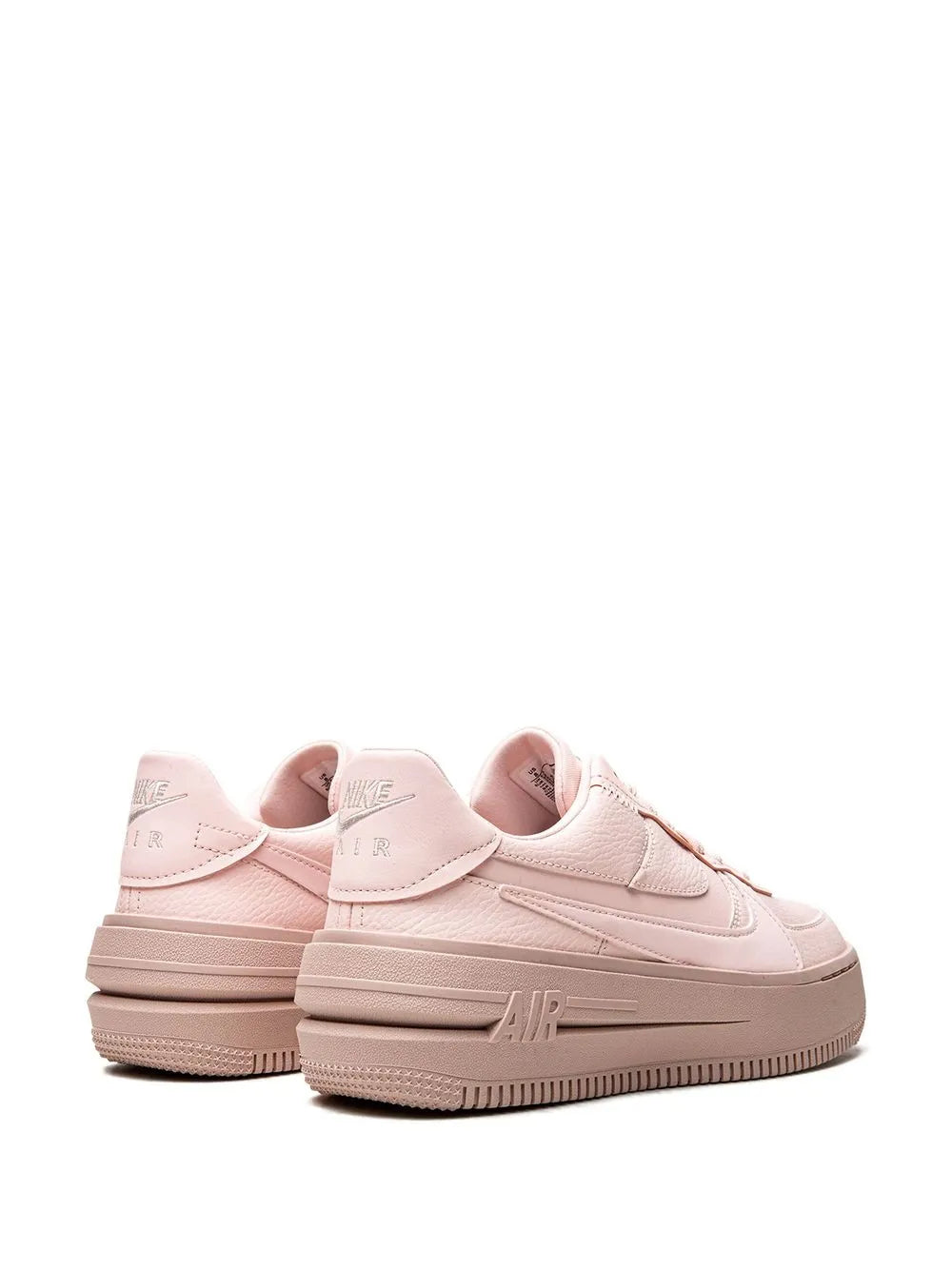 Nike Air Force 1 sneakers, light pink pair with rear heel tabs and Air branding