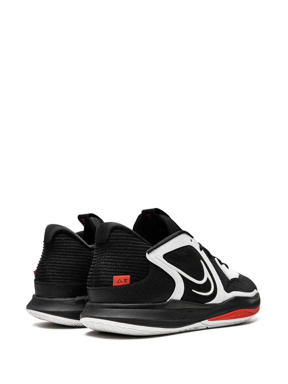Black and white lace-up low-top sneaker with side swoosh detail and orange-red outsole