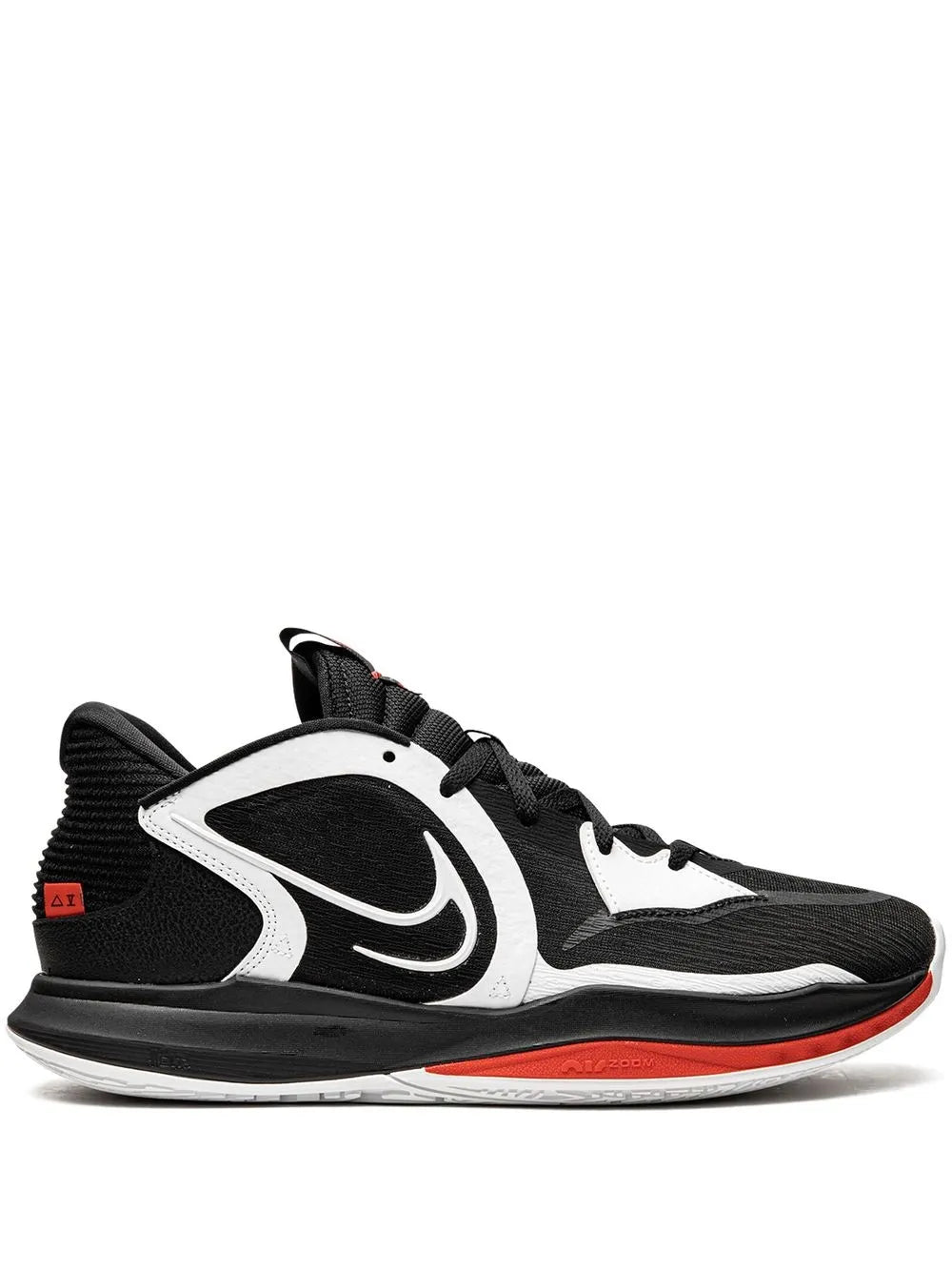 Black and white low-top basketball sneaker with Nike swoosh and orange-red outsole