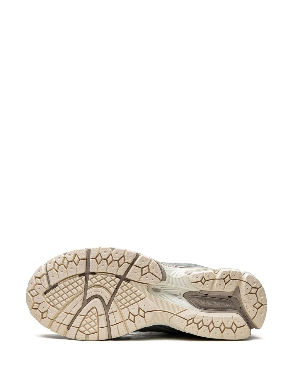 New Balance 2002R Kith rubber outsole view with tread, beige and dark accents