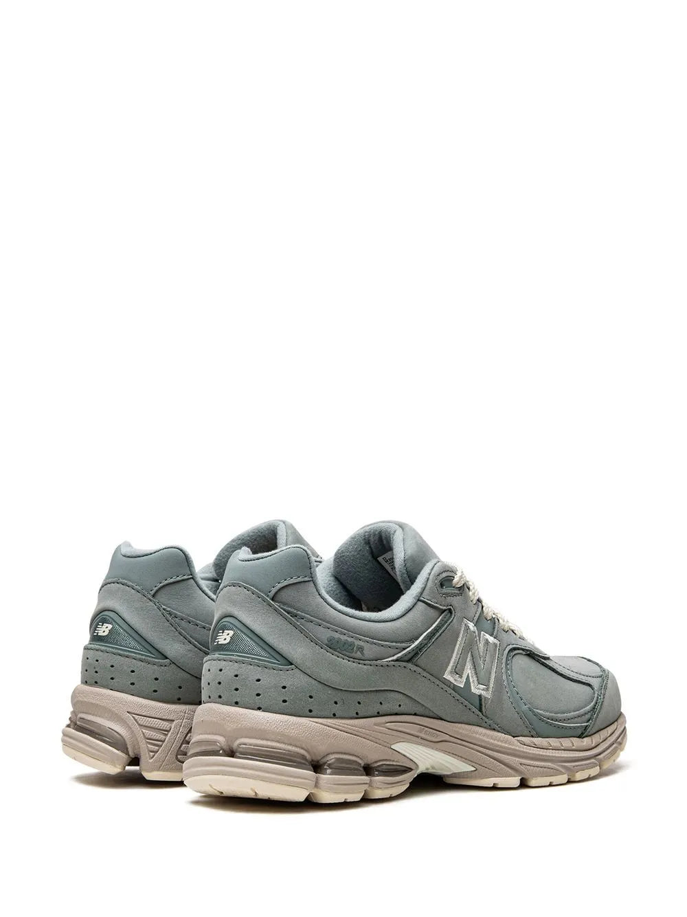 New Balance 2002R Kith pair of mint green low-top sneakers, cushioned heel