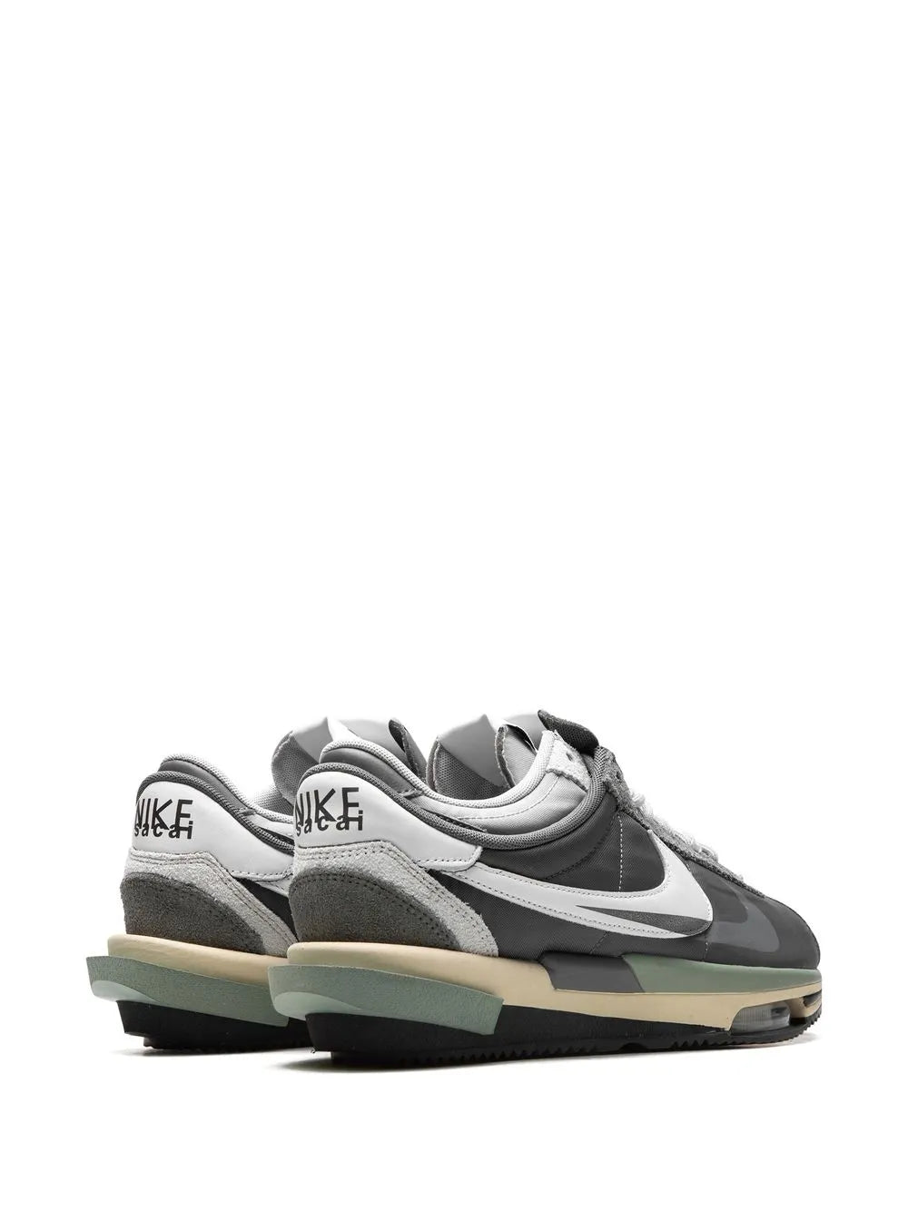 Grey low-top sneakers pair view with white Swoosh and mint-toned outsole