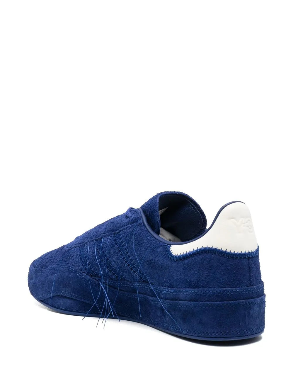 Blue suede low-top sneaker heel view with white contrast collar and laces