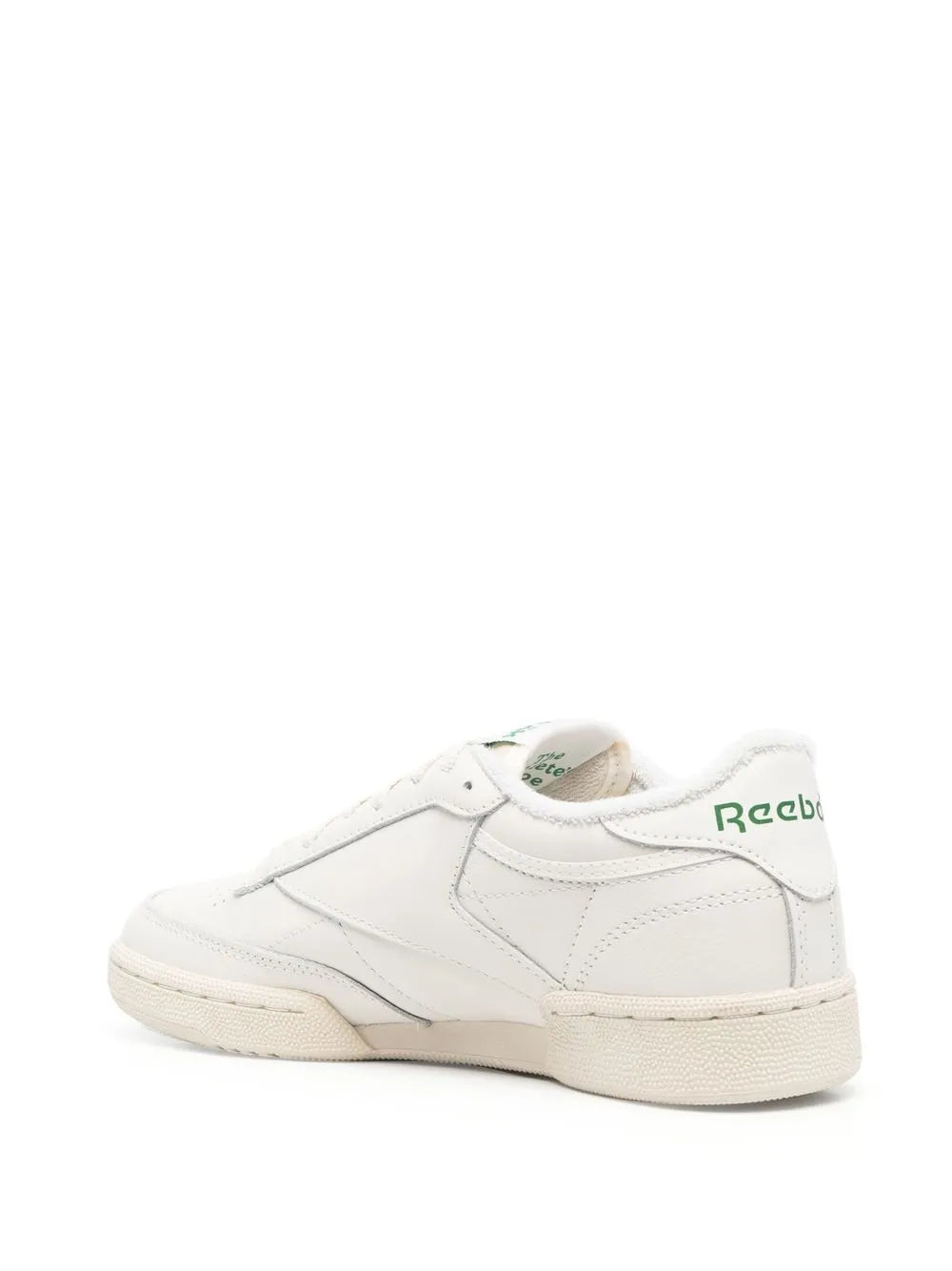 Reebok light beige low-top sneakers, rear view with raised logo, textured sole