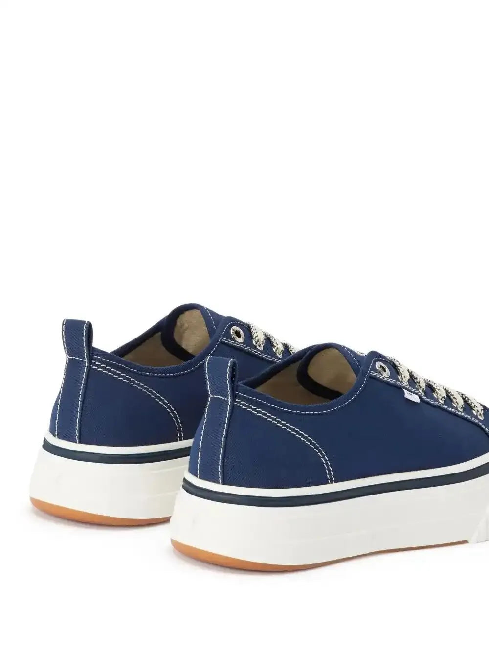 Back view of dark blue low-top lace-up sneakers with white platform and heel tab
