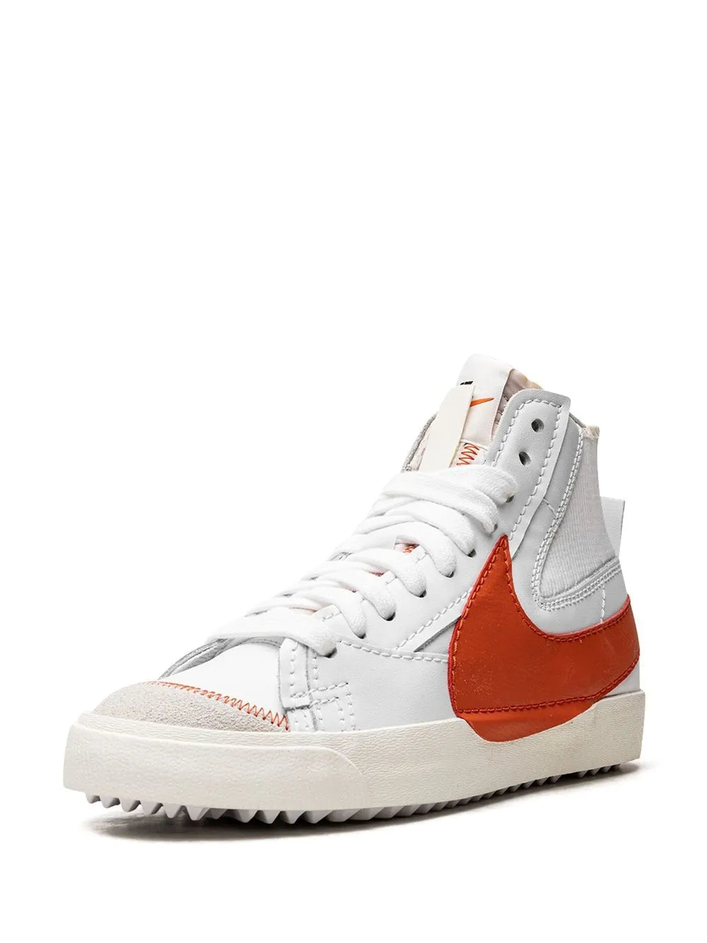 Side high-top sneaker with orange Swoosh, white laces, gray panels, textured sole