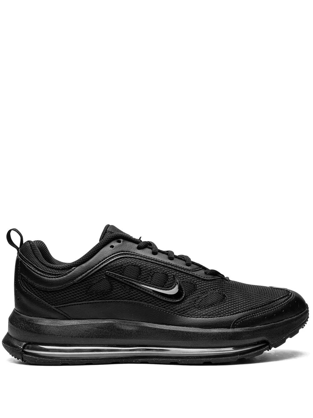 Black low-top sneakers with Nike Swoosh, laces, and visible air-cushioned sole