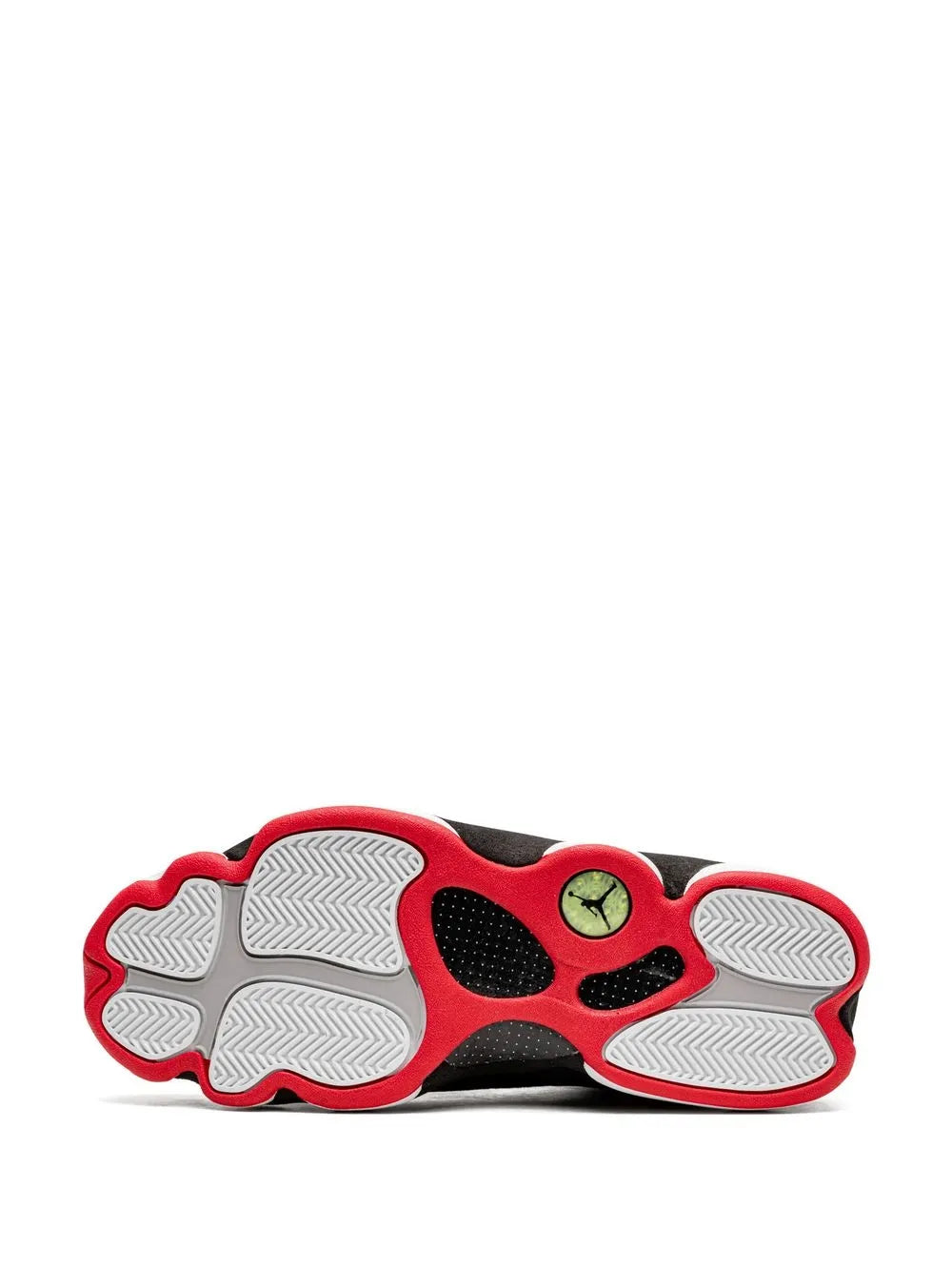 Black sneaker outsole with red edge, patterned tread and circular logo pods