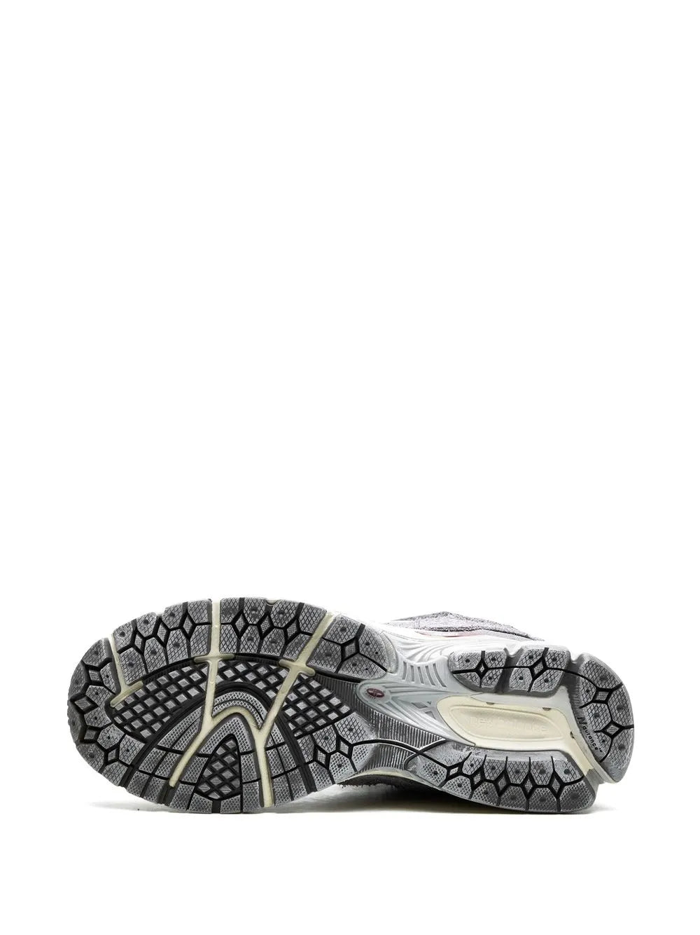 2002R sneakers outsole: gray tread with beige midsole, bottom side view