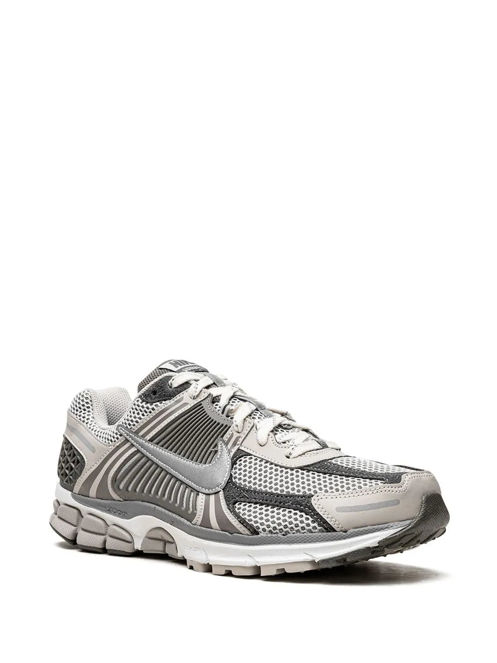 Nike running sneaker, side view with gray laces and sculpted sole