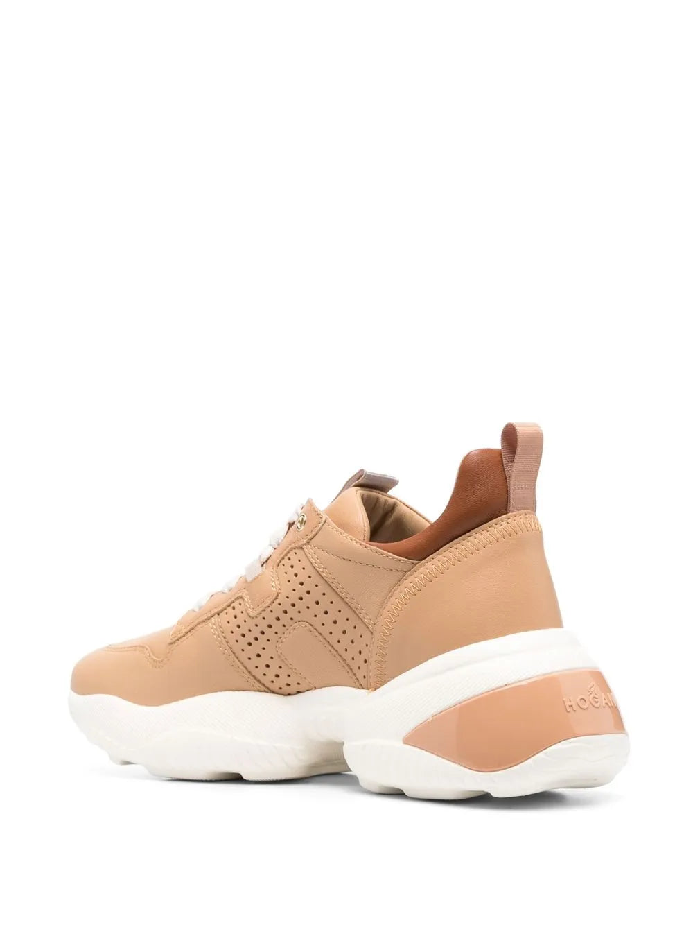 Tan low-top sneaker with cushioned collar and white wedge sole