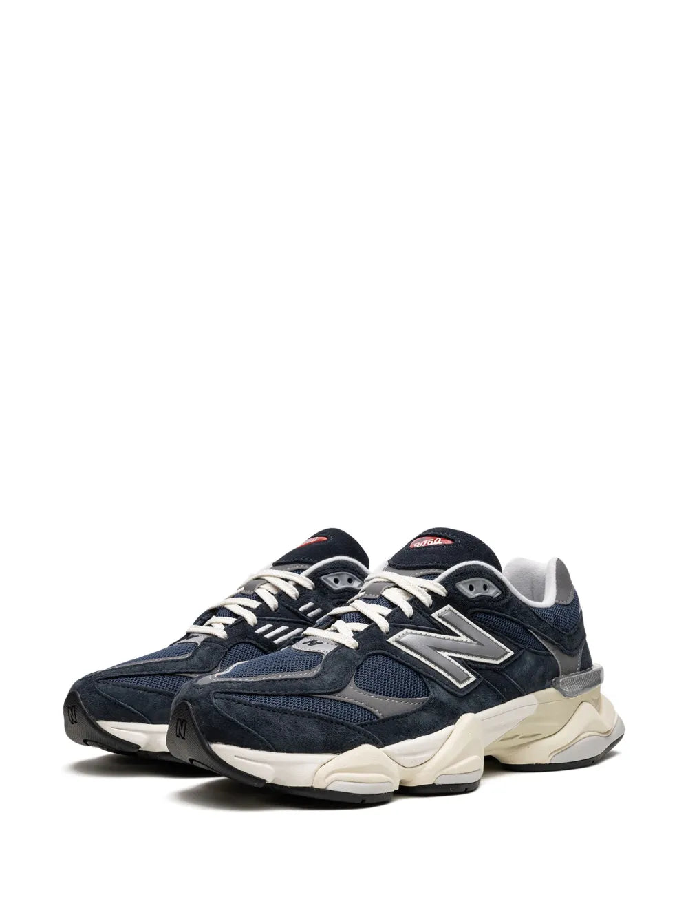New Balance 9060 navy sneakers, lace-up profile with N branding and cream midsole