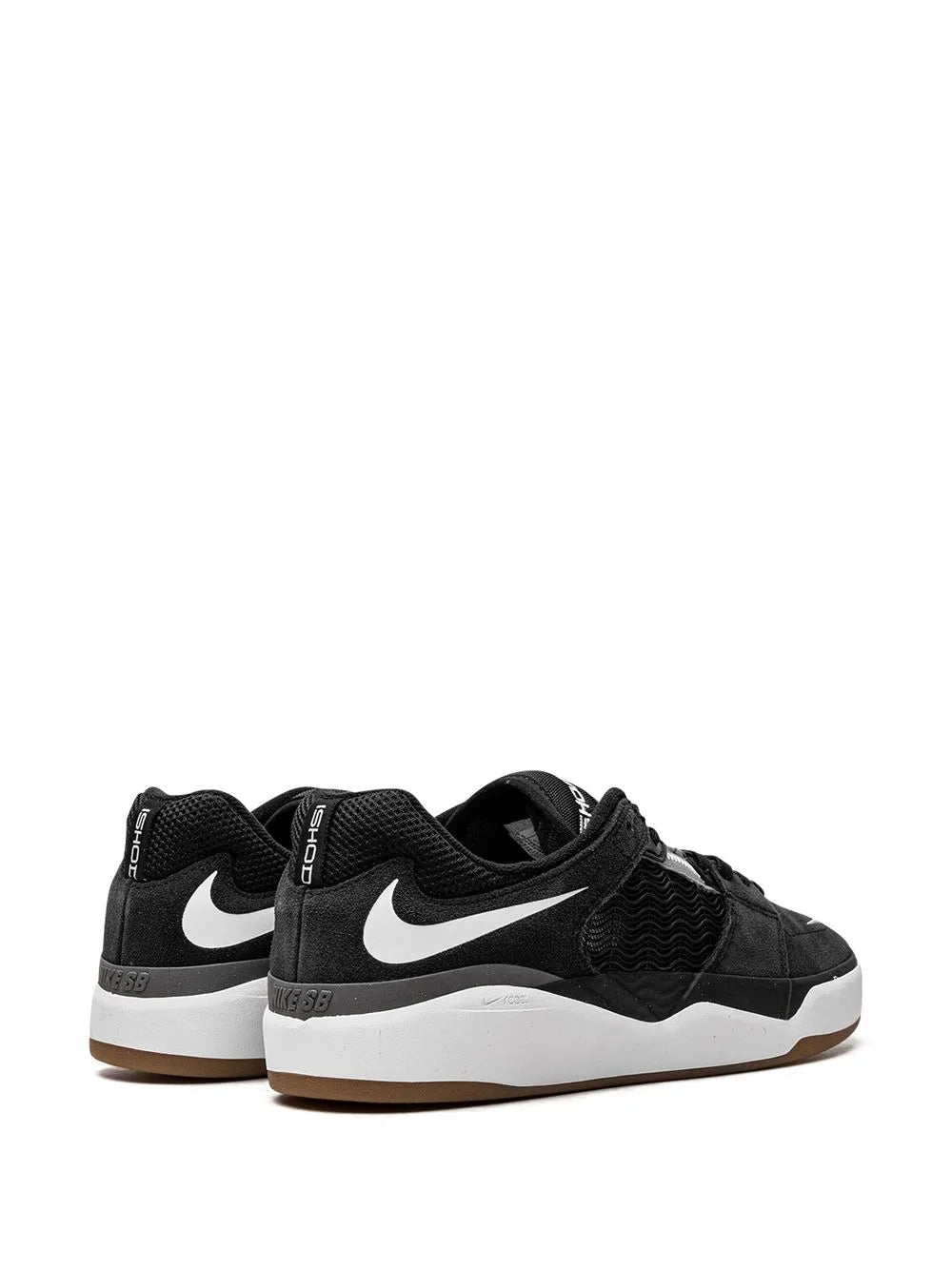 Pair of black low-top Nike SB skate shoes with white Swoosh and padded heel tabs.