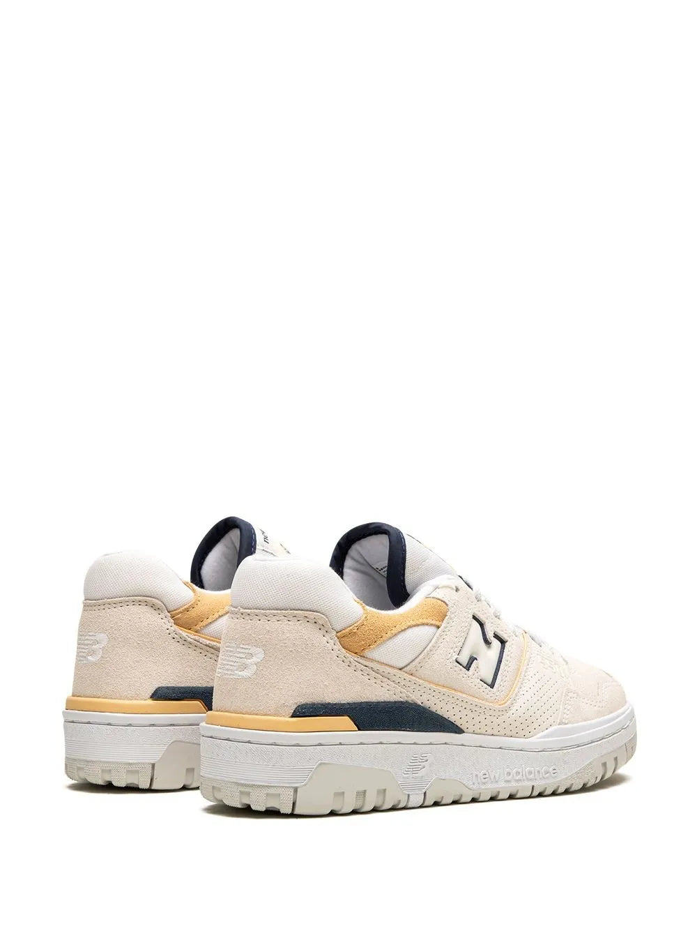 New Balance low-top sneaker with cream heel, gold accents, navy collar, lace-up.