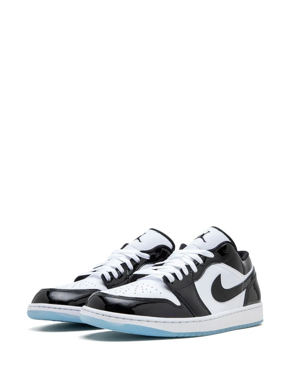 Black and white low-top sneakers, lace-up front, Nike swoosh, light blue sole
