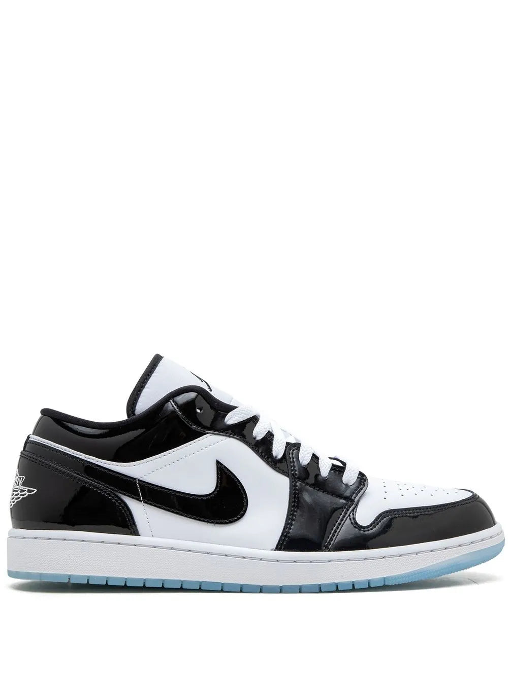 Black and white low-top sneakers with Nike swoosh and light blue outsole