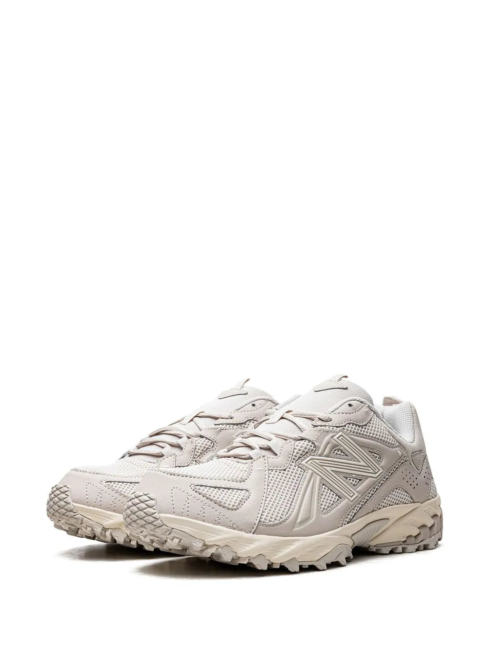 Grey lace-up trail sneakers from front, mesh upper with sculpted outsole