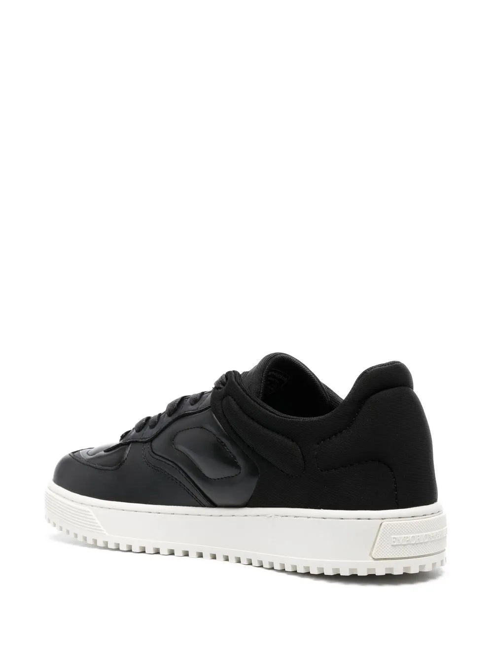Black low-top lace-up sneakers with quilted side panels and white rubber sole
