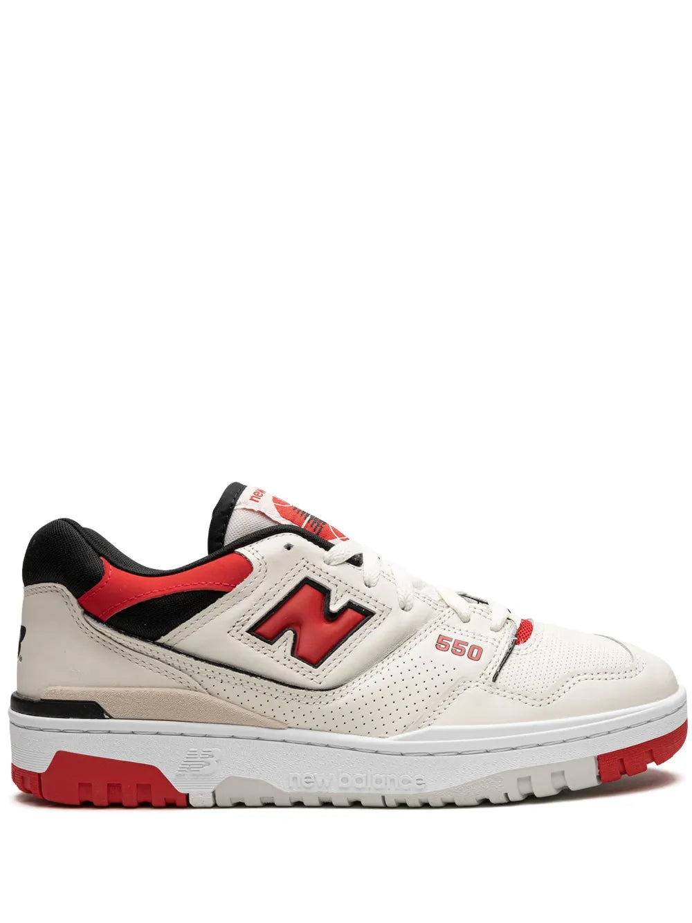 Low-top lace-up sneaker with cream uppers, red accents, and black trim