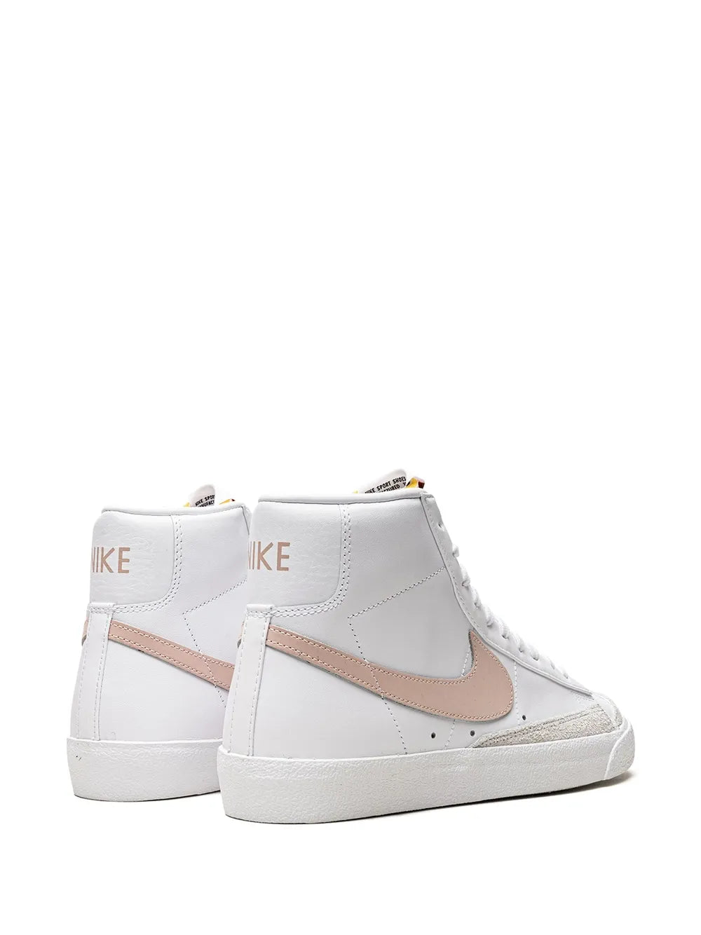 Nike mid-top sneakers, white with tan/pink swoosh and rear heel branding