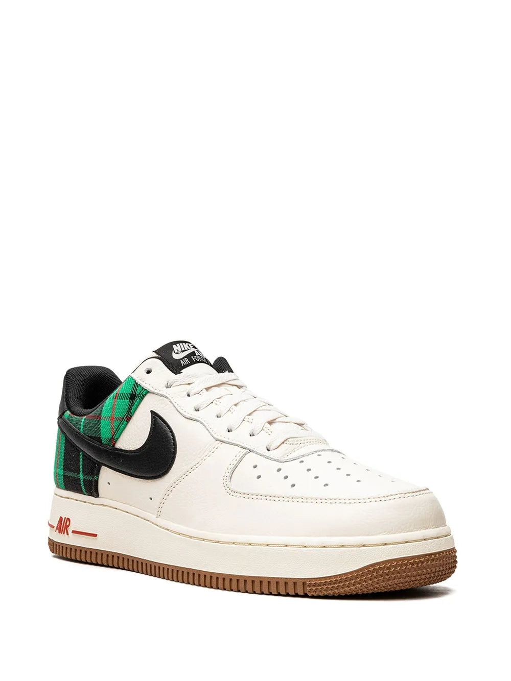 Low-top Nike sneakers in white with black Swoosh, green plaid heel panel, gum sole