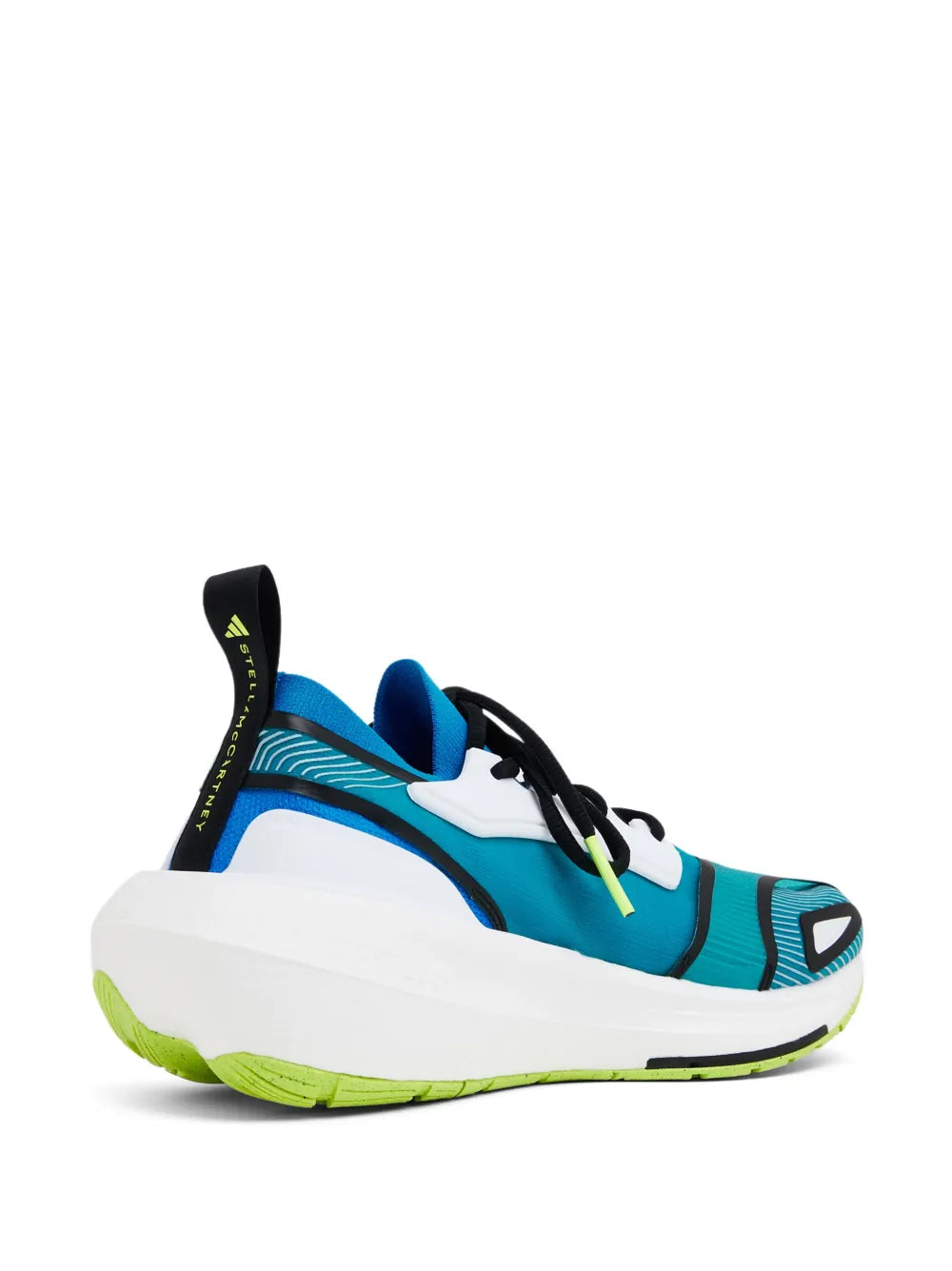 Side view of blue adidas low-top sneaker with black laces and lime green outsole
