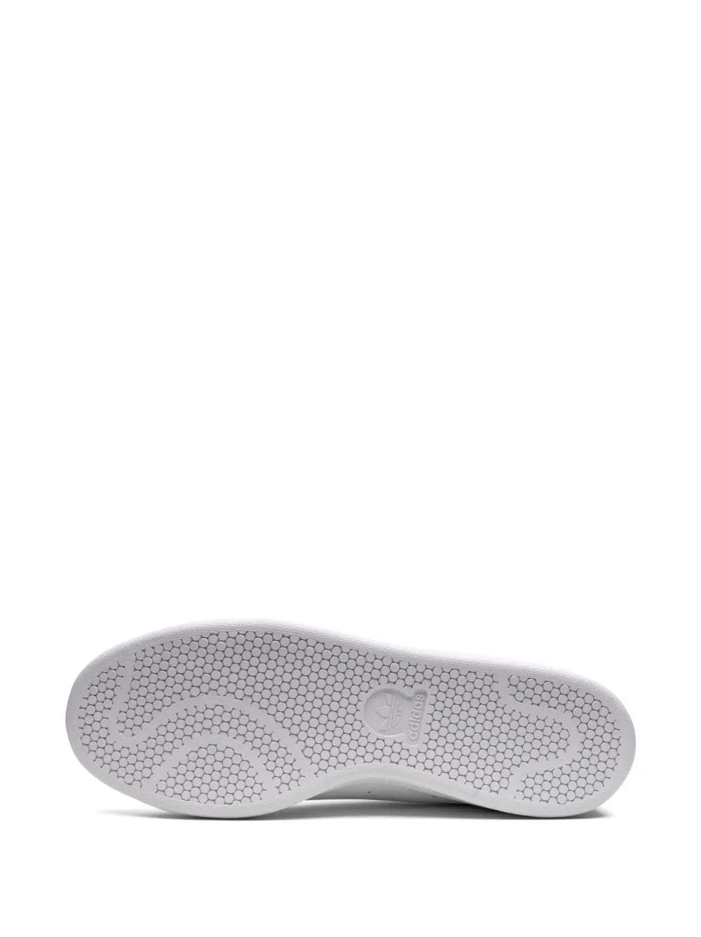 White adidas Stan Smith outsole with textured hex tread pattern