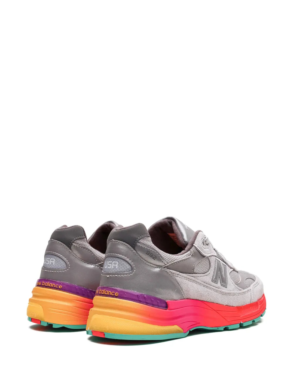 Grey running sneaker pair view with multicolor heel and side N logo