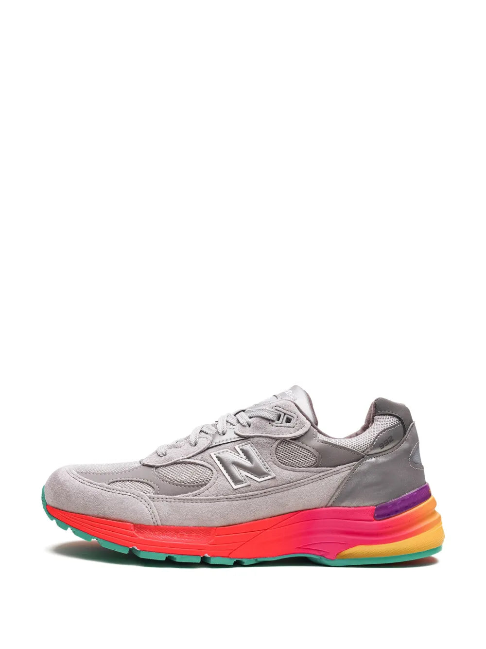 Grey running sneaker with white laces and orange-pink outsole stripe