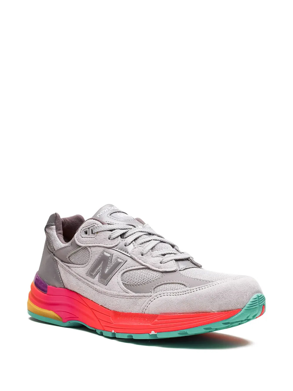 Grey running sneaker side view with N logo, white laces, and bright outsole