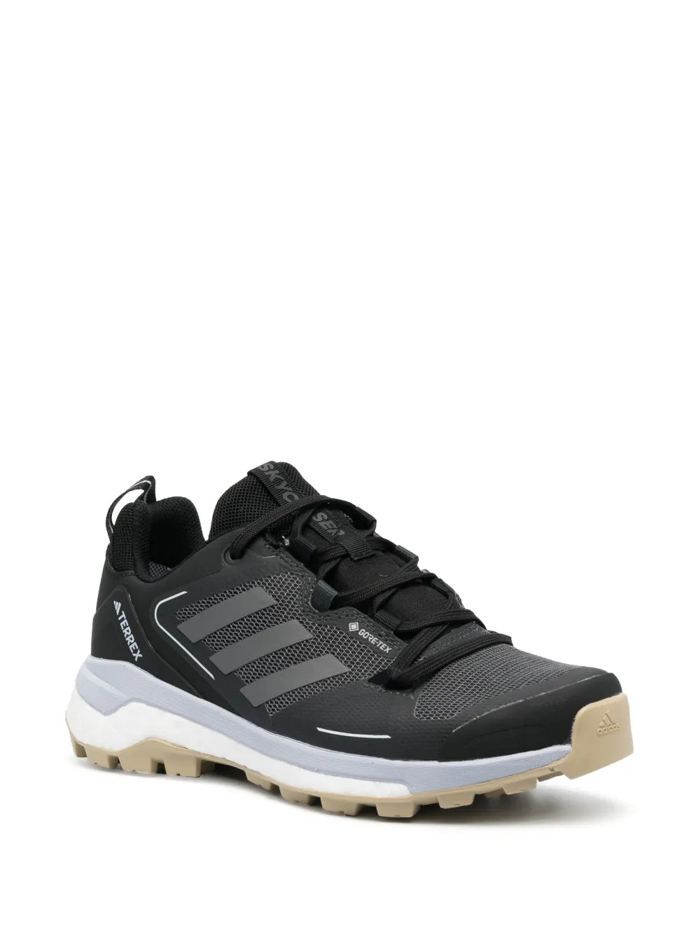 Black adidas low-top sneakers, side profile view, chunky tread sole, lace-up
