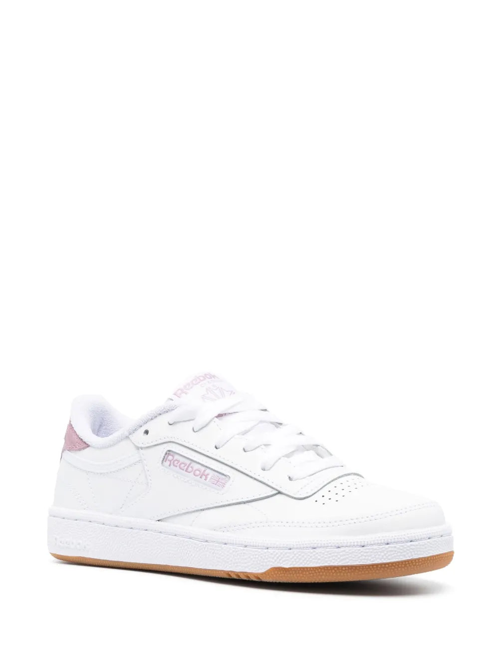 White low-top sneaker with pink logo on side and tan gum sole