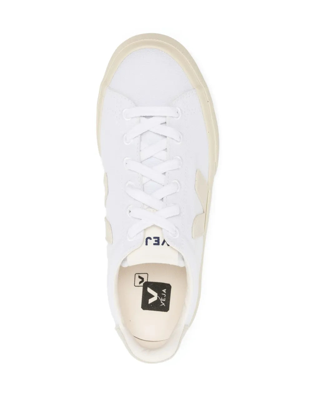 Beige-and-white low-top sneakers, top view of white laces and beige side panel