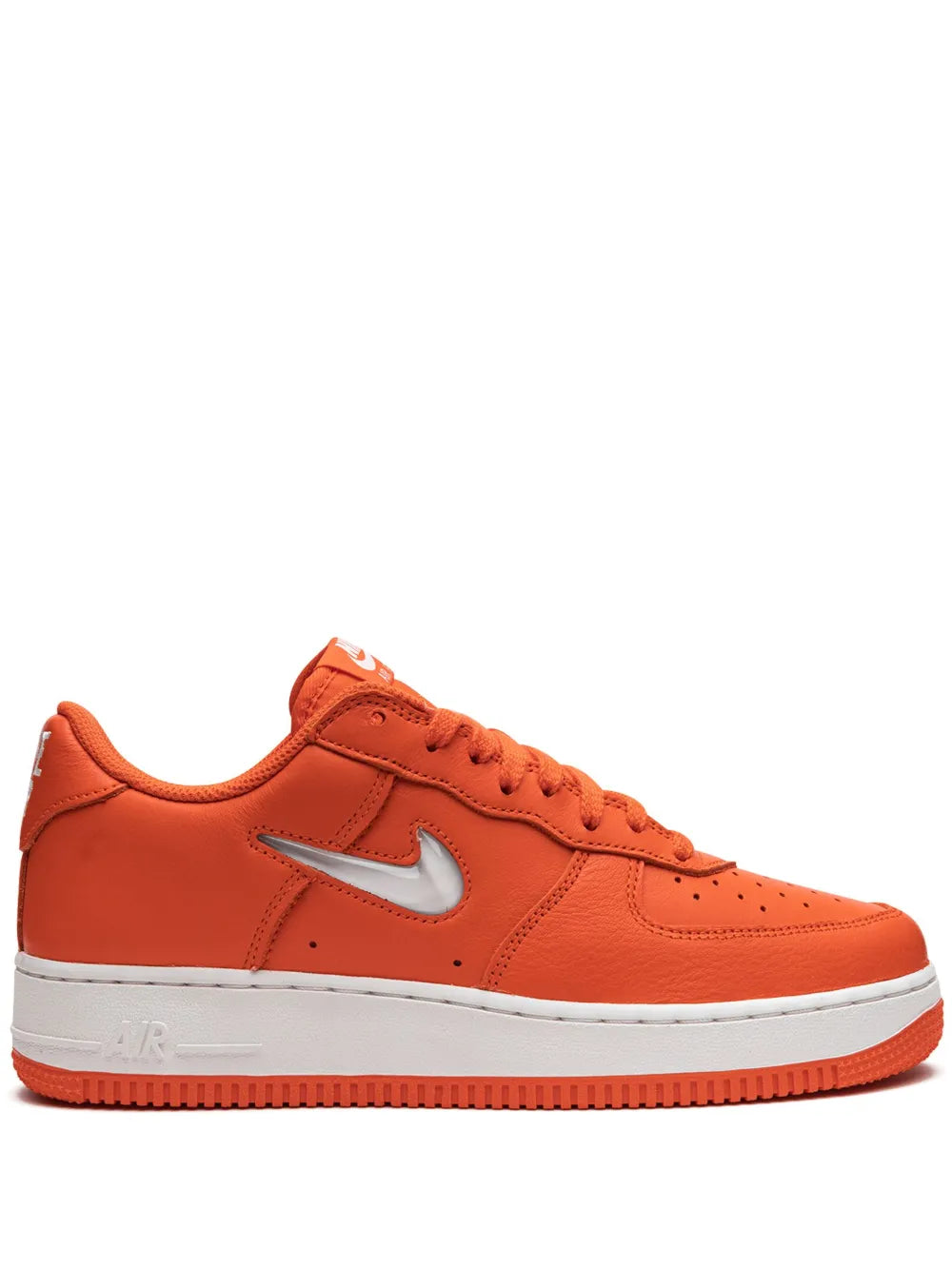 Orange low-top Nike Air Force 1 sneakers with white swoosh and lace-up closure