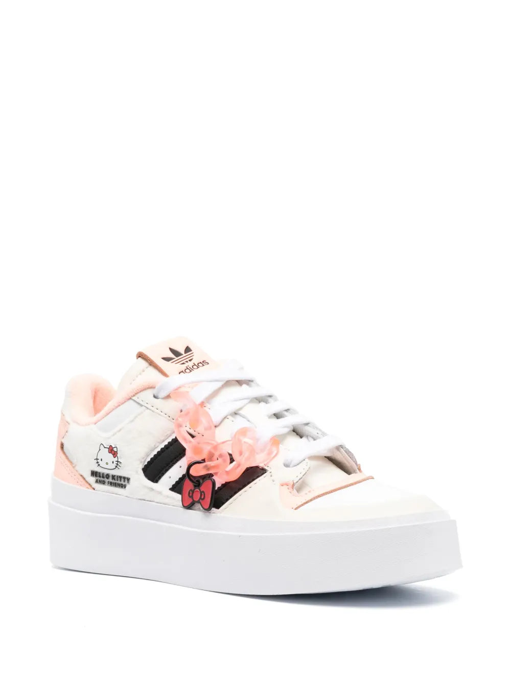 White low-top sneakers with pink laces and Hello Kitty-themed side graphic.