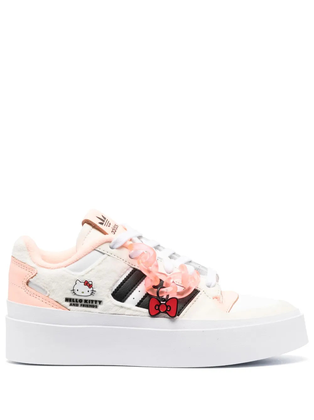 White low-top sneakers with pink trim, Hello Kitty graphic and black side stripes.