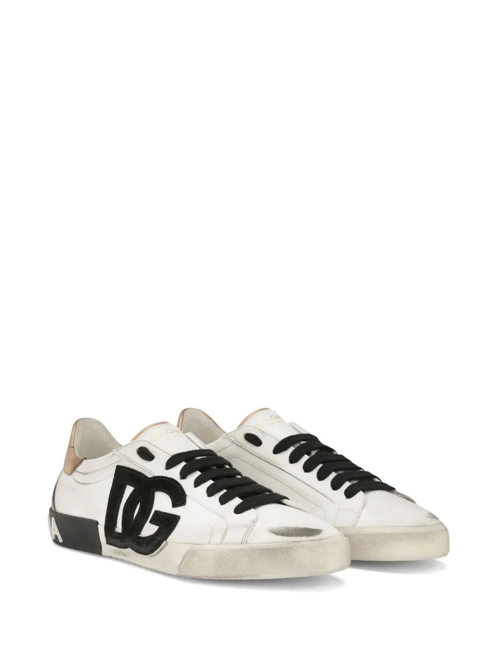Pair of white low-top sneakers with black laces and DG logo on side